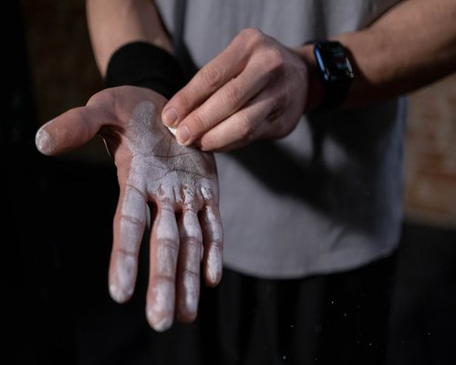 Close up of gym chalk and hands performing functional movement