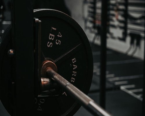 Heavy barbell loaded with plates ready for lifting
