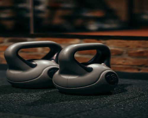 Detail shot of modern kettlebells in a dark premium gym